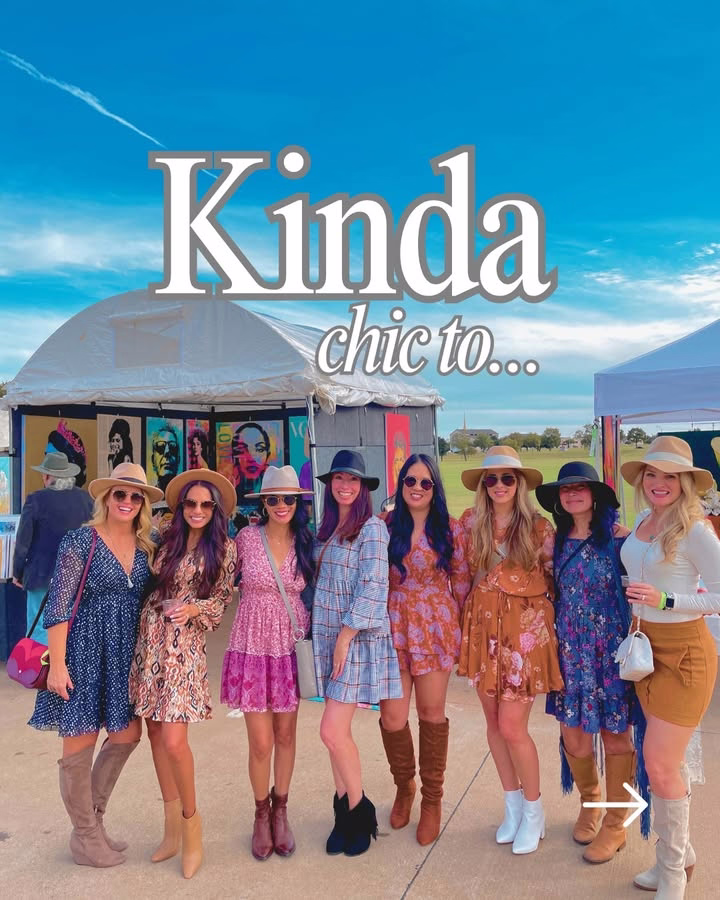 A group of people in colorful outfits and hats stand together outdoors. Behind them are art displays inside vendor tents. The sky is bright and clear. Large text at the top reads, "Kinda chic to..."