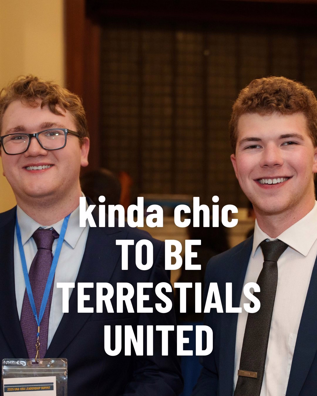Two people standing next to each other in a shirt and tie with text overlay on the image: "kinda chic TO BE TERRESTIALS UNITED"